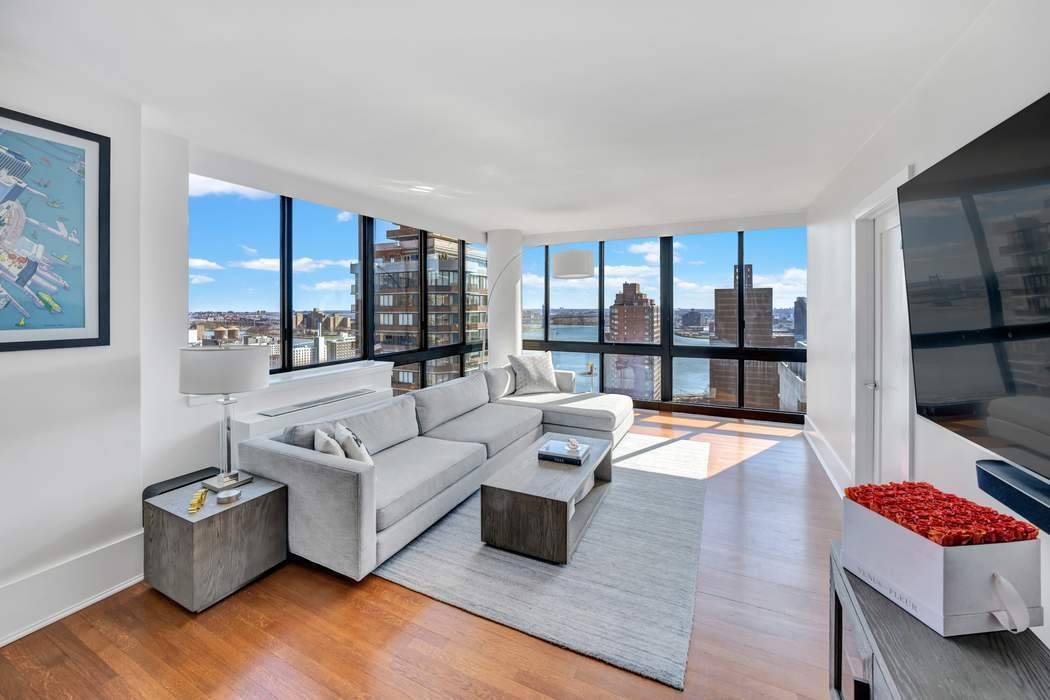 Coveted high floor, sprawling corner residence with floor to ceiling windows offers a stunning vantage point of the East River stretching north and east.
