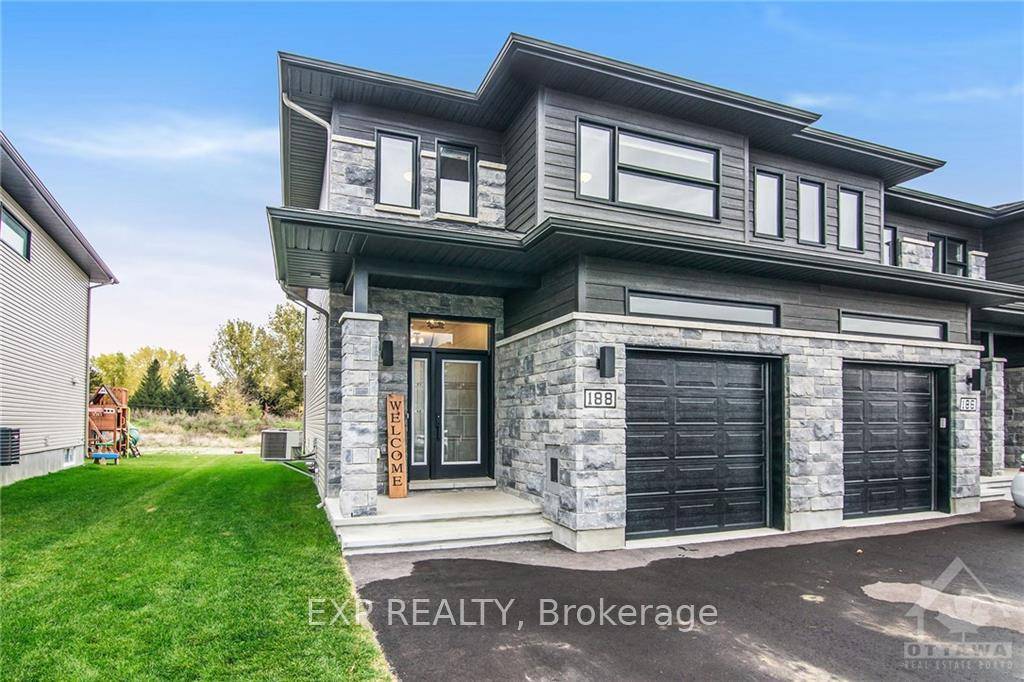 Welcome to 188 Argile Street a beautifully upgraded end unit townhome 2020 in the highly desirable Domaine de la Rivie re Nation community !