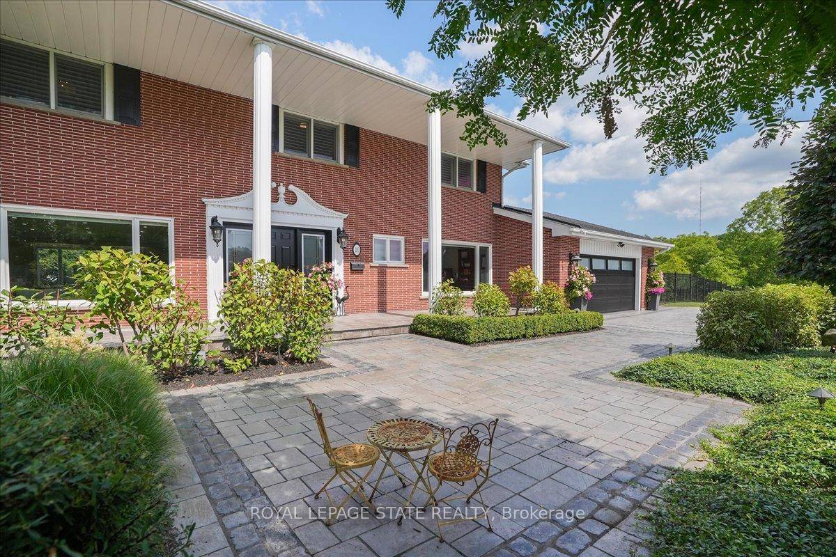 Perched atop the stunning Niagara Escarpment, this beautifully maintained home offers seasonal panoramic views of Lake Ontario and the Toronto skyline.