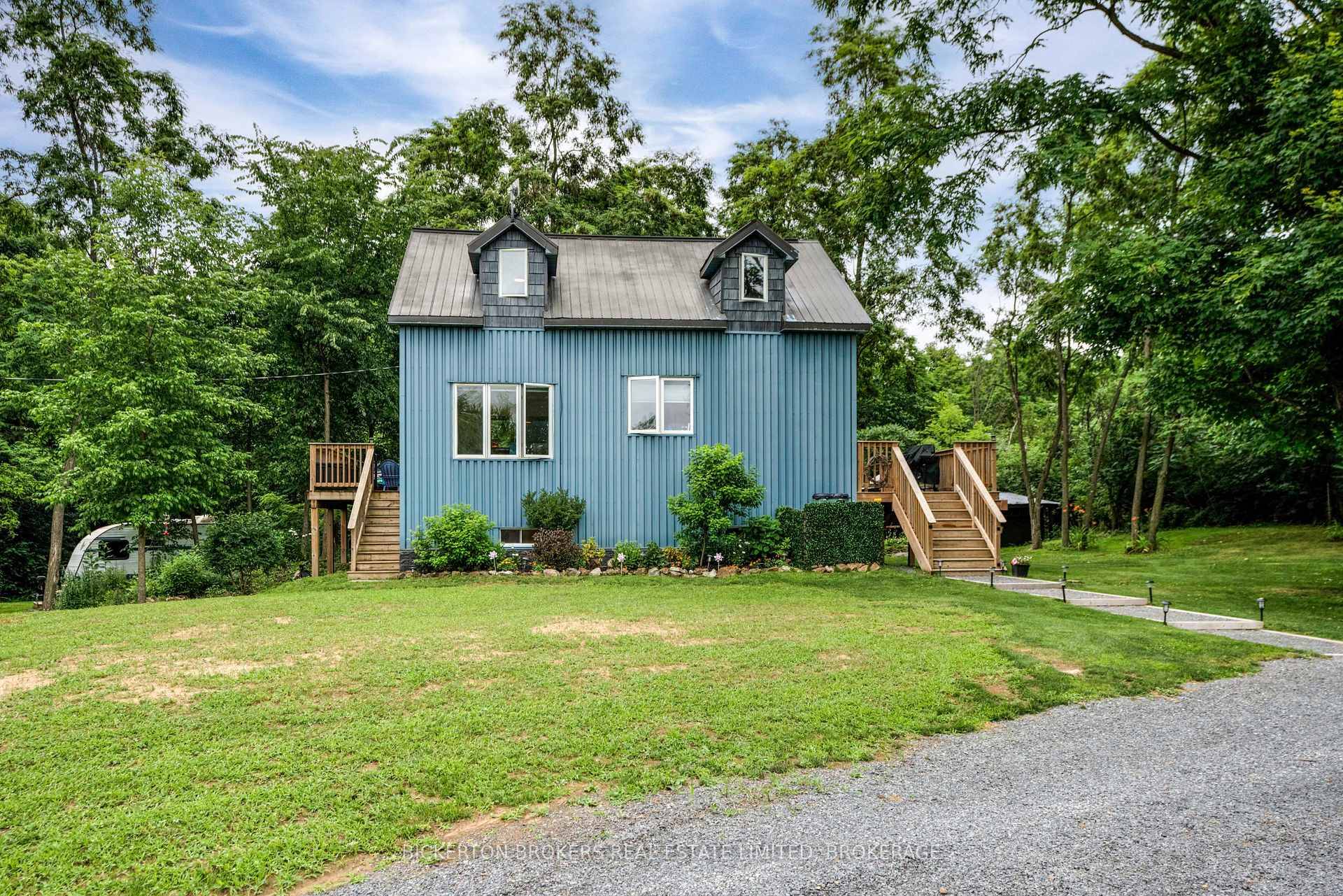 Tucked along a quiet, well maintained country road, this enchanting 1.