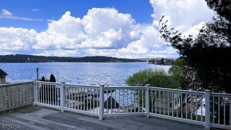 Welcome to this exceptional lakefront Colonial in the sought after Great Cove section of Lake Hopatcong.