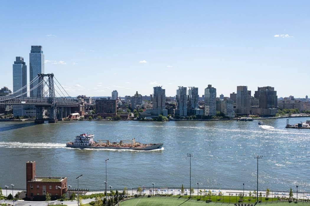 Located on a high floor, this bright and airy two bedroom apartment boasts sweeping views of the NYC skyline, East River, and iconic bridges.