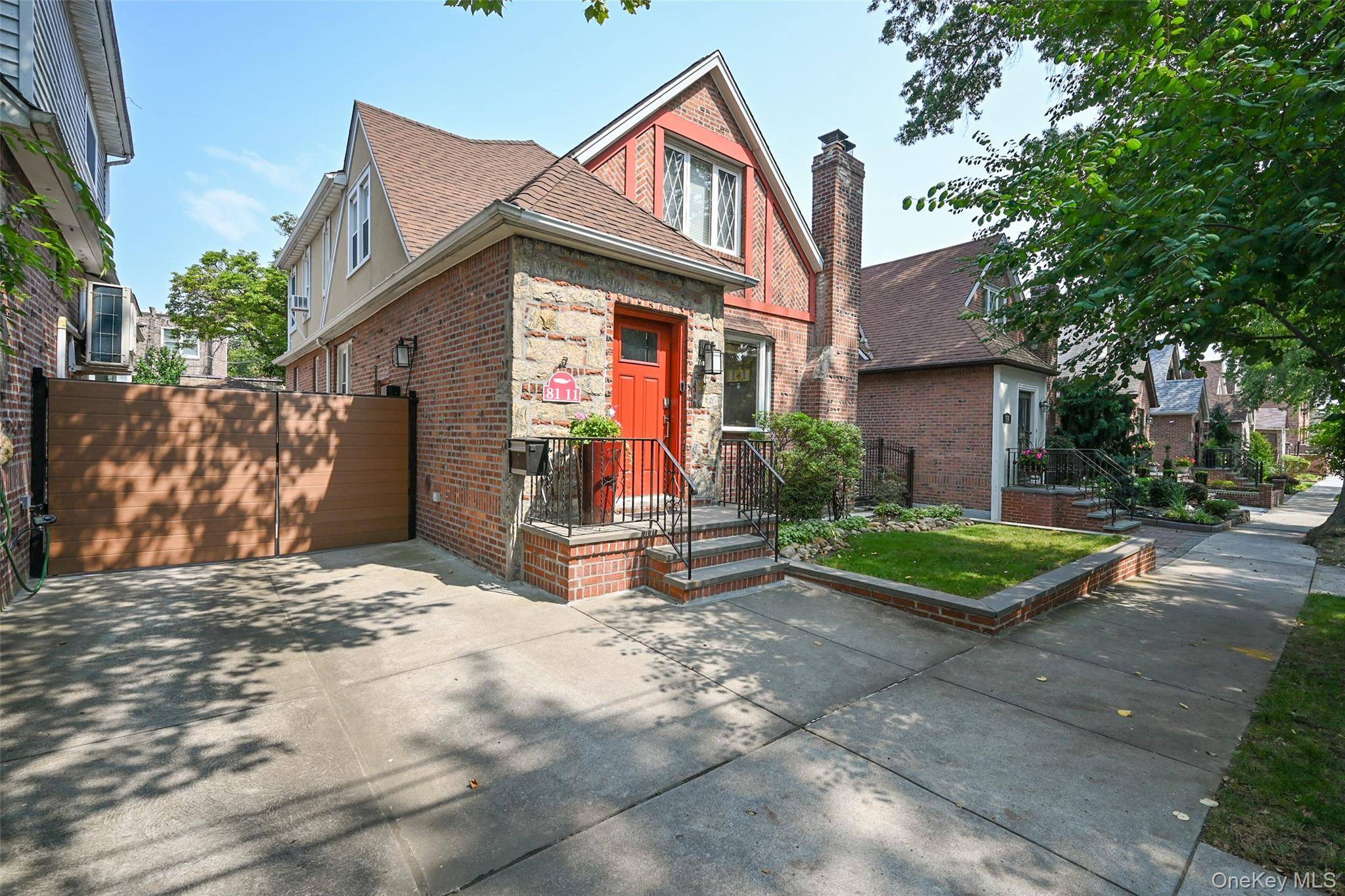 New to the market Turnkey, smart, and stylish Contemporary Tutor colonial gem in Middle Village.