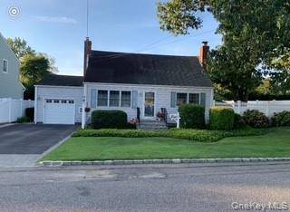 This charming 4 bedroom Cape style home exudes warmth and timeless elegance, nestled on a beautifully landscaped property that feels like a serene park.