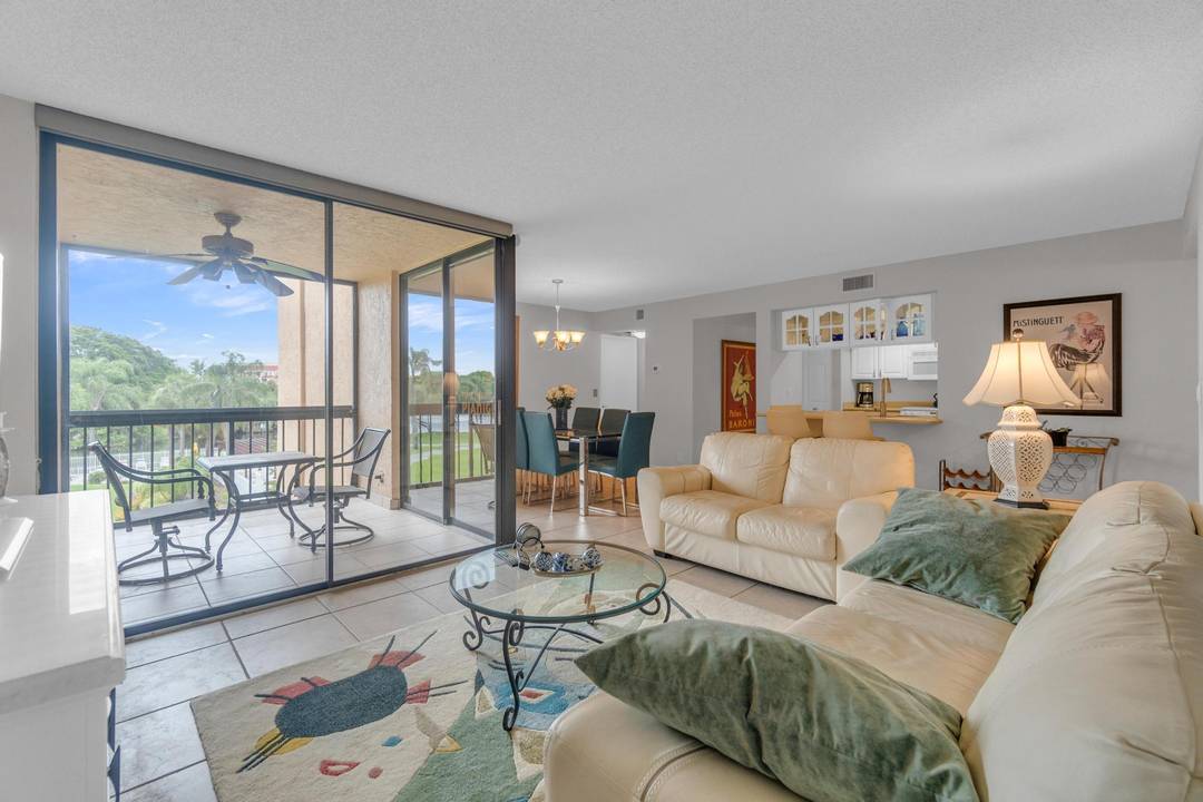 Gorgeous, fully furnished, and updated 2BR, 2BA condo in the resort style community of Delray Racquet Club, offering stunning lake and pool views.