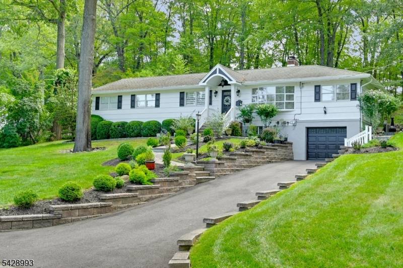 A true gem expanded ranch in Oakland's Dogwood section that offers style, comfort, and thoughtful updates !