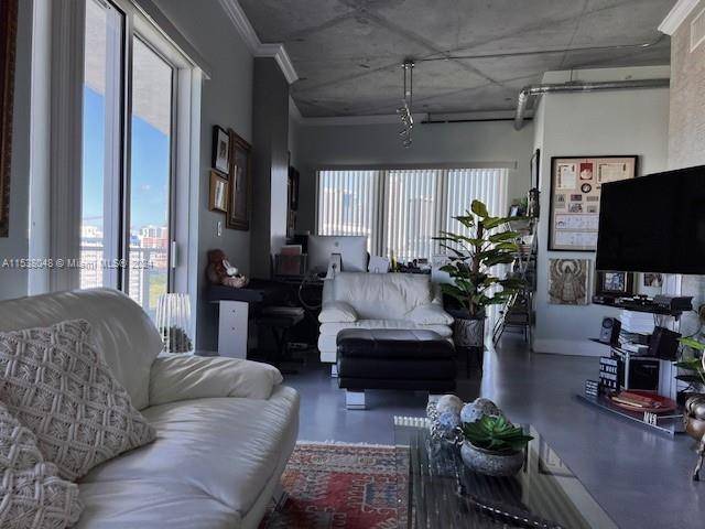 Live in Miami and enjoy the best views of the Miami Riverfront and Skyline of the city from this unobstructed corner unit with wrap around balcony.