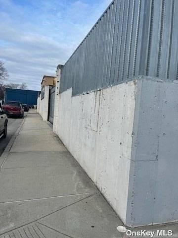 Corner Brownfield Land Lot with 20 years tax incentives and foundation in place for a building.