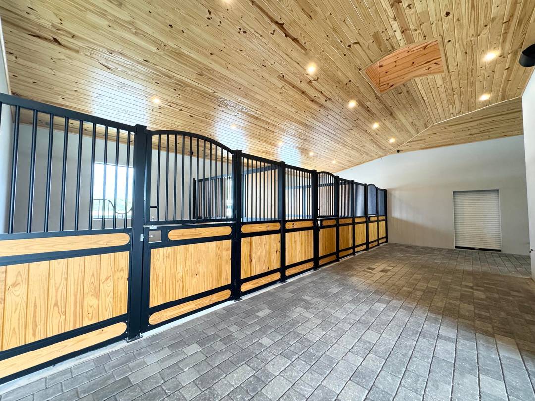 Newly built in 2024, this exceptional 18 stall equestrian facility offers top tier design and premium finishes throughout.