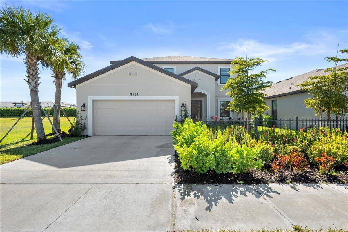 The main living area on the ground floor combines the kitchen, casual dining area, gathering room with two story high ceiling, and dining room for an appealing open feel.