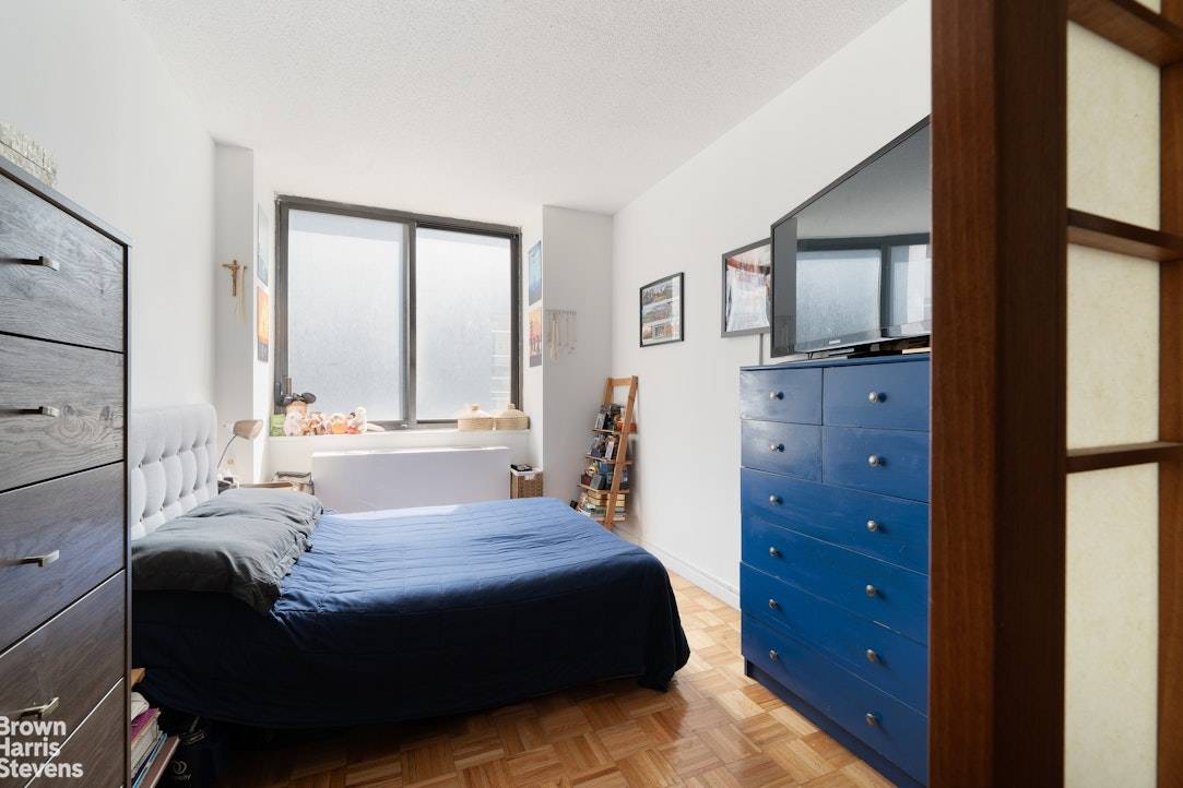 Welcome to this beautifully designed Upper East Side studio, thoughtfully converted into a one bedroom oasis with elegant Japanese sliding shoji doors that create both serenity and privacy.