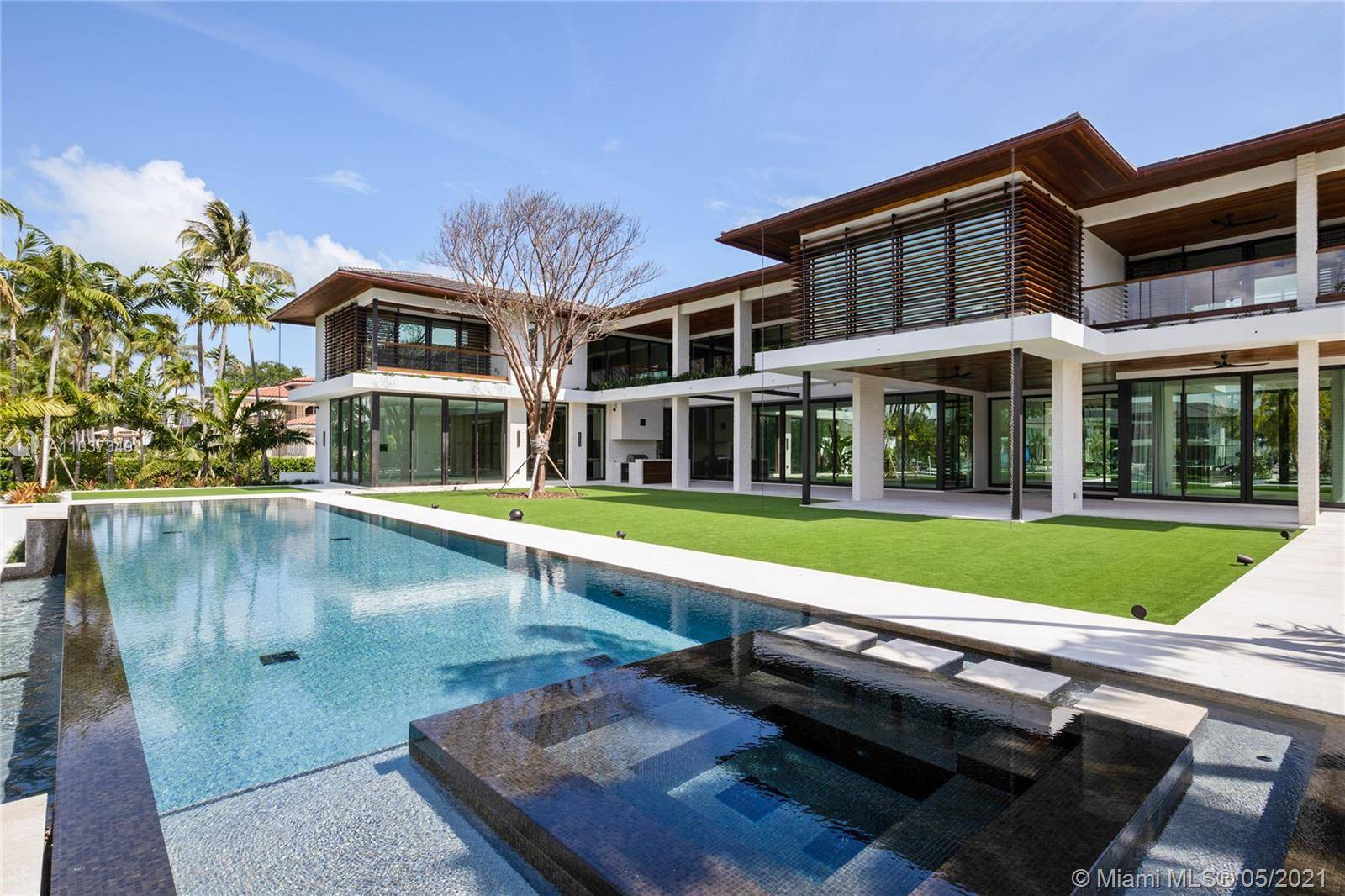 Immediate Occupancy, Only New Construction in Coveted Gables Estates ; Cesar Molina Design Tropical Mid Century Modern Style w 360 Water views ; Near 1 Acre Corner lot w New ...