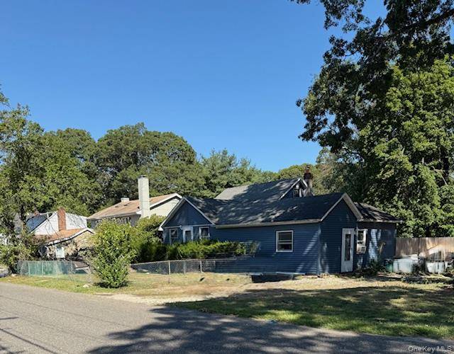 Single family home with an accessory apartment on a spacious corner lot in Huntington Station !