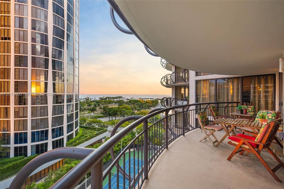 Experience waterfront living in this expansive 3 bedroom, 3 bathroom residence at Grove Towers, showcasing sweeping Biscayne Bay views and stunning sunsets over Coconut Grove.