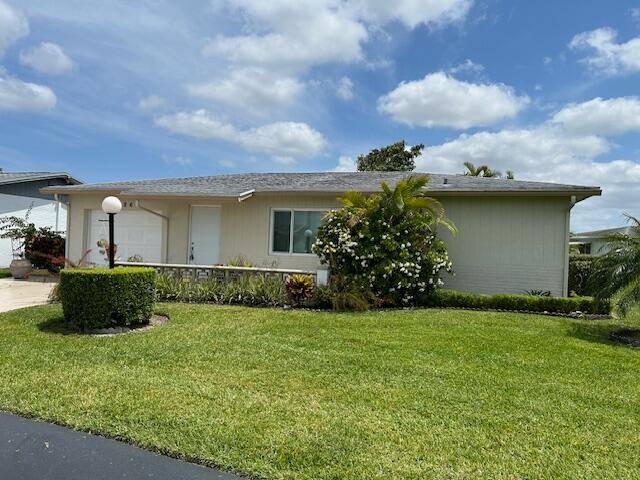 Lovely 2 2 home with 1 car Garage, family room and lg enclosed patio.