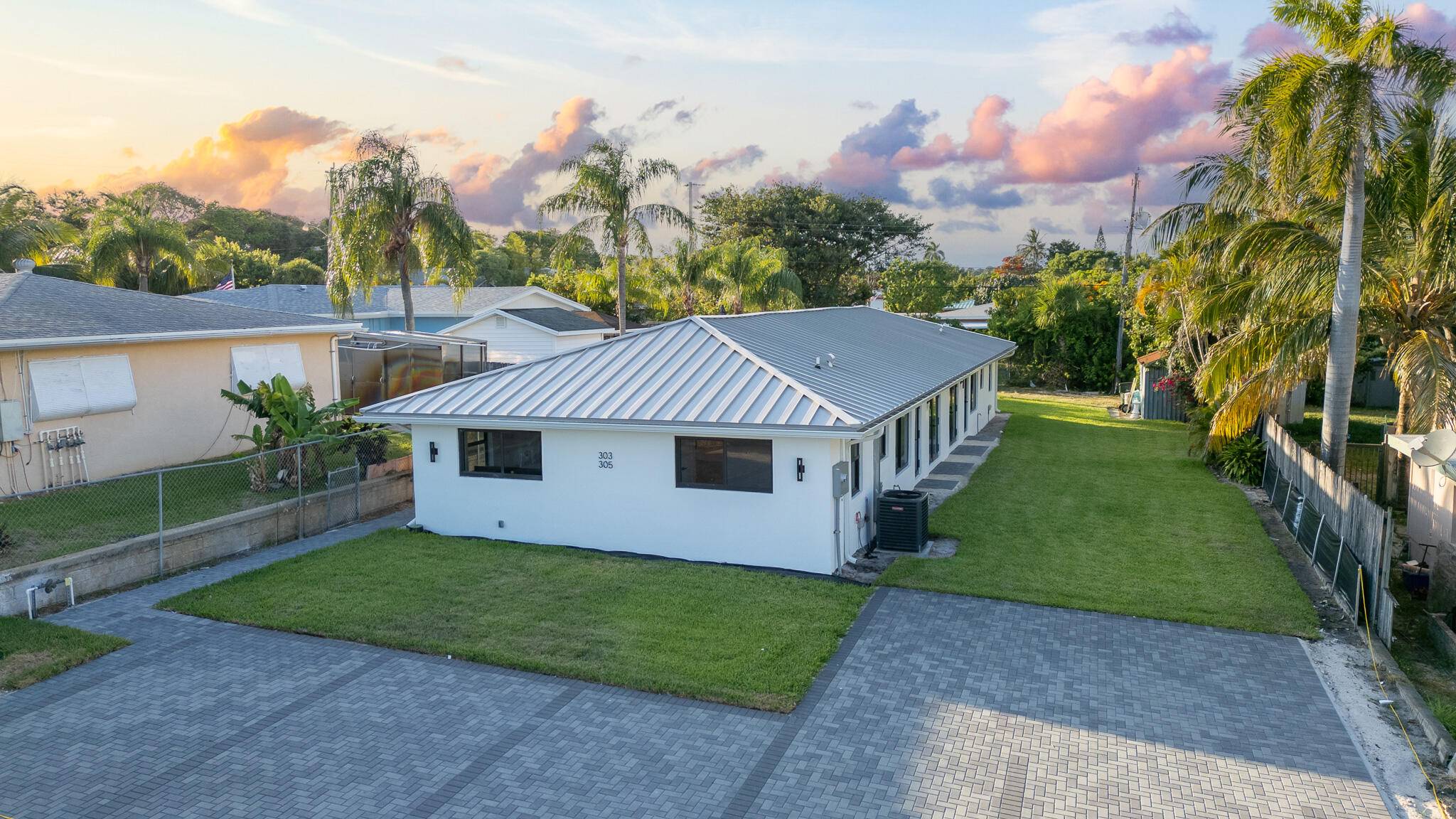 Welcome to a fully renovated 3 bed 2 bath duplex villa where modern luxury meets prime investment potential !
