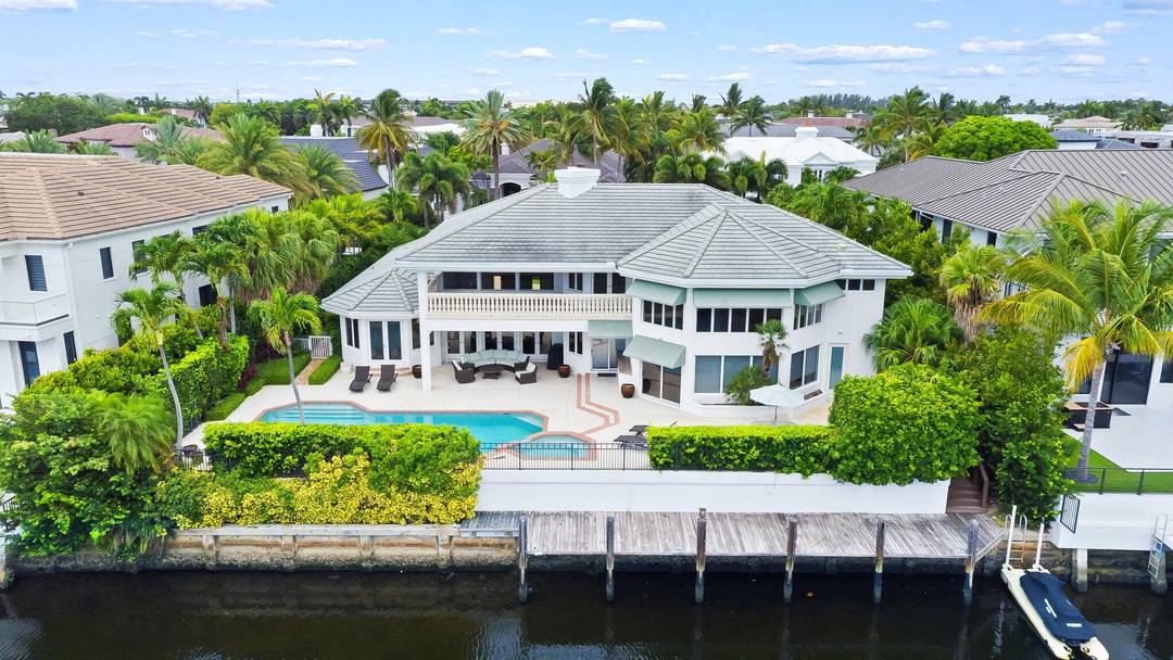 First Time on the Market Annual Rental in Royal Palm Yacht Country Club Welcome to 396 E Coconut Palm Road, a stunning waterfront estate available for lease in one of ...