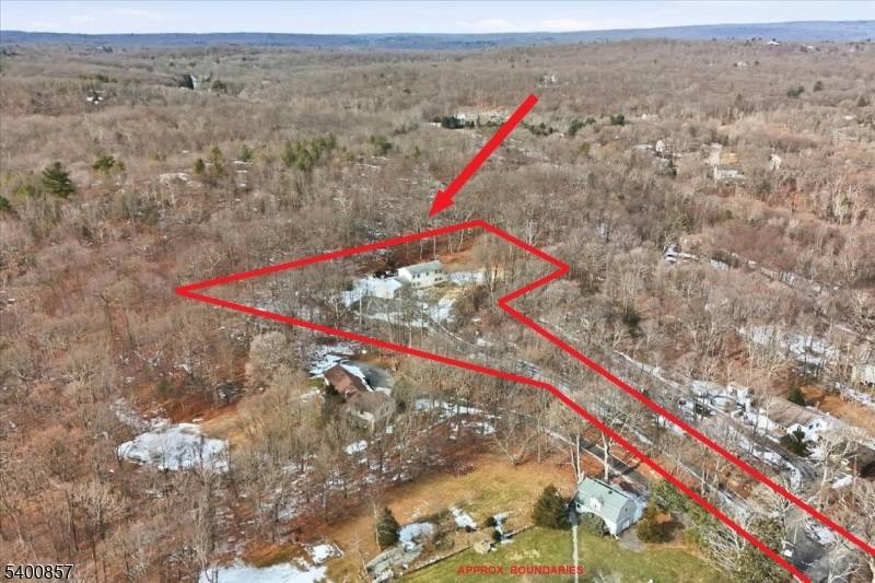 Escape to your own private 3 acre sanctuary at 611 Snake Den Road ; an elegantly renovated retreat surrounded by nature, yet moments from the conveniences of West Milford.