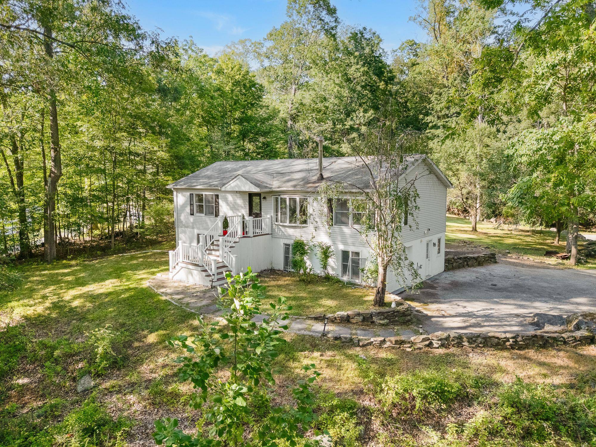 Nestled on a serene 1. 81 acres of land with stunning views of Colabaugh Pond and just a short walk to the scenic Croton Reservoir.