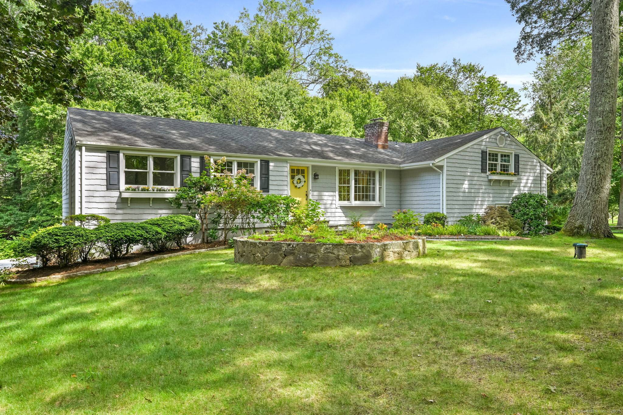 Convenience and serenity intersect at this unique lower North Stamford property on a cul de sac.