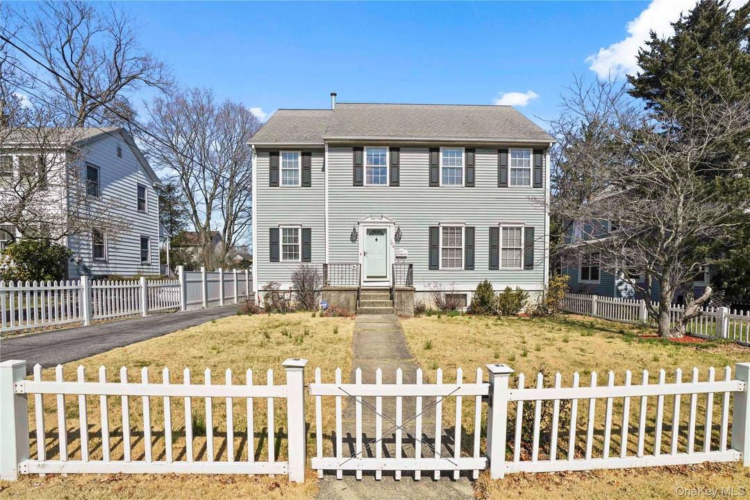 This delightful home features a tiled kitchen with stainless steel appliances, including a gas range, dishwasher, and large sink.