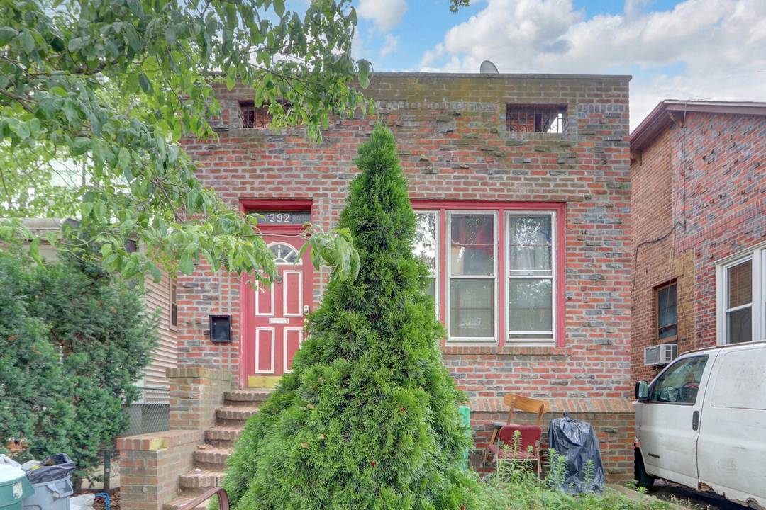 Colonial style home featuring five bedrooms, two full baths, a formal dining room, and a den.