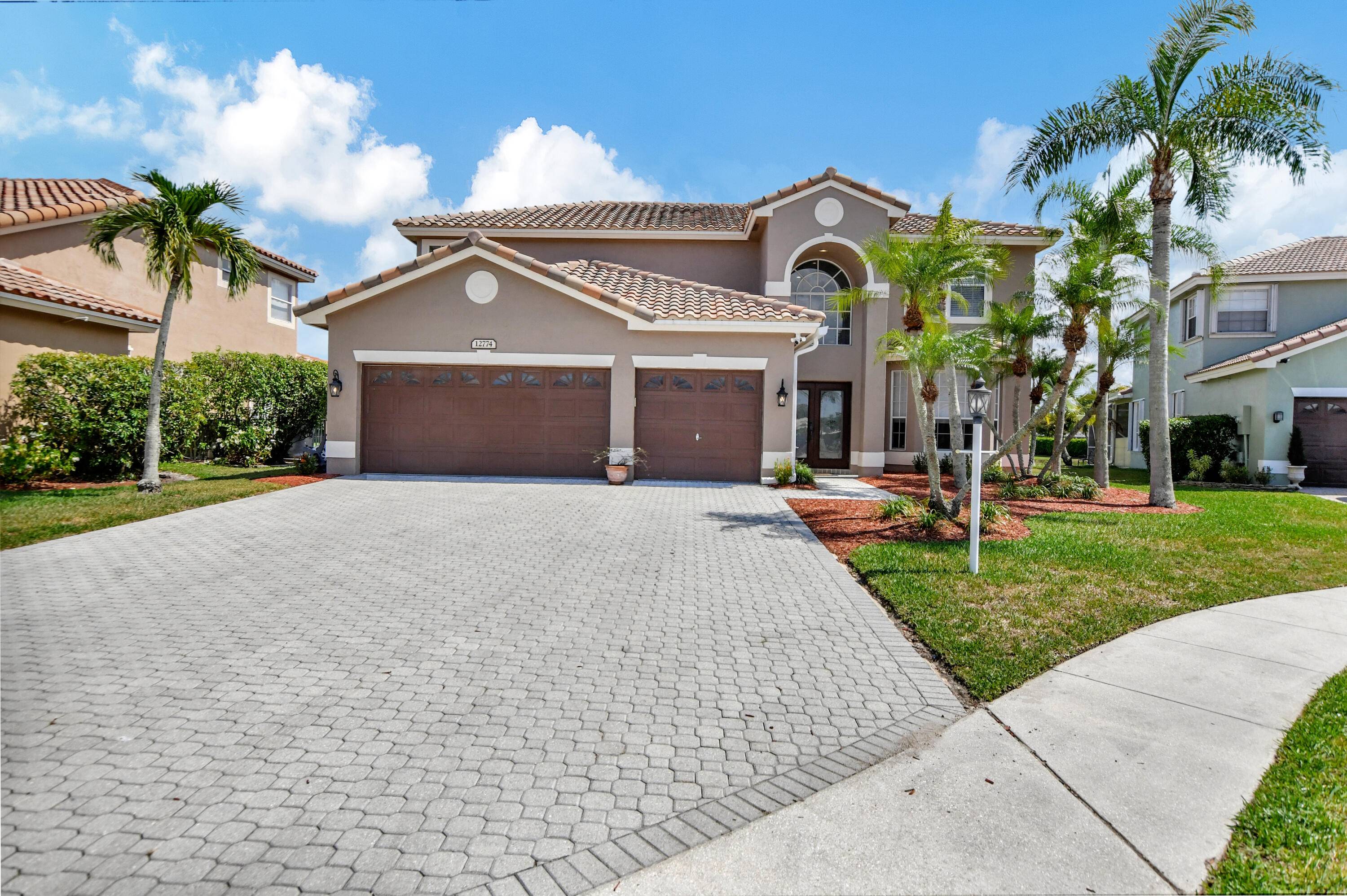 Visit this stunning lakefront home in beautiful West Boca Raton.