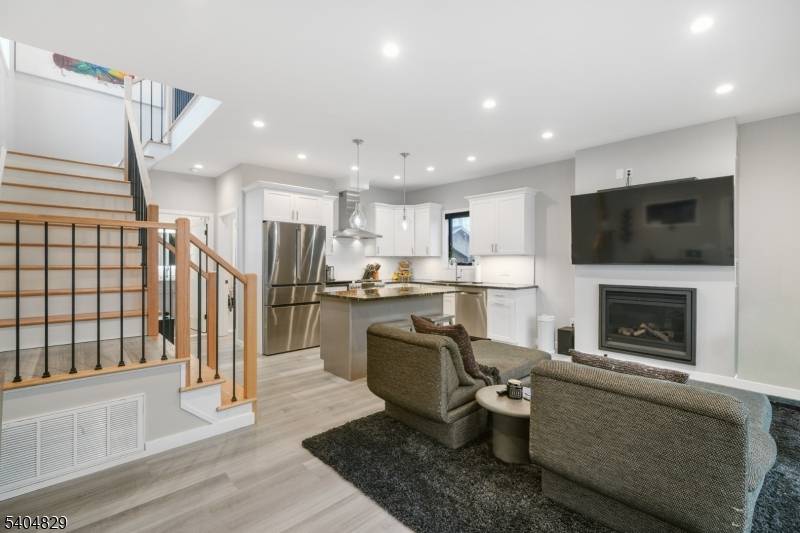 Wake up to shimmering water views and end your day with golden sunsets in this exceptional LAKEFRONT retreat on Upper Greenwood Lake.