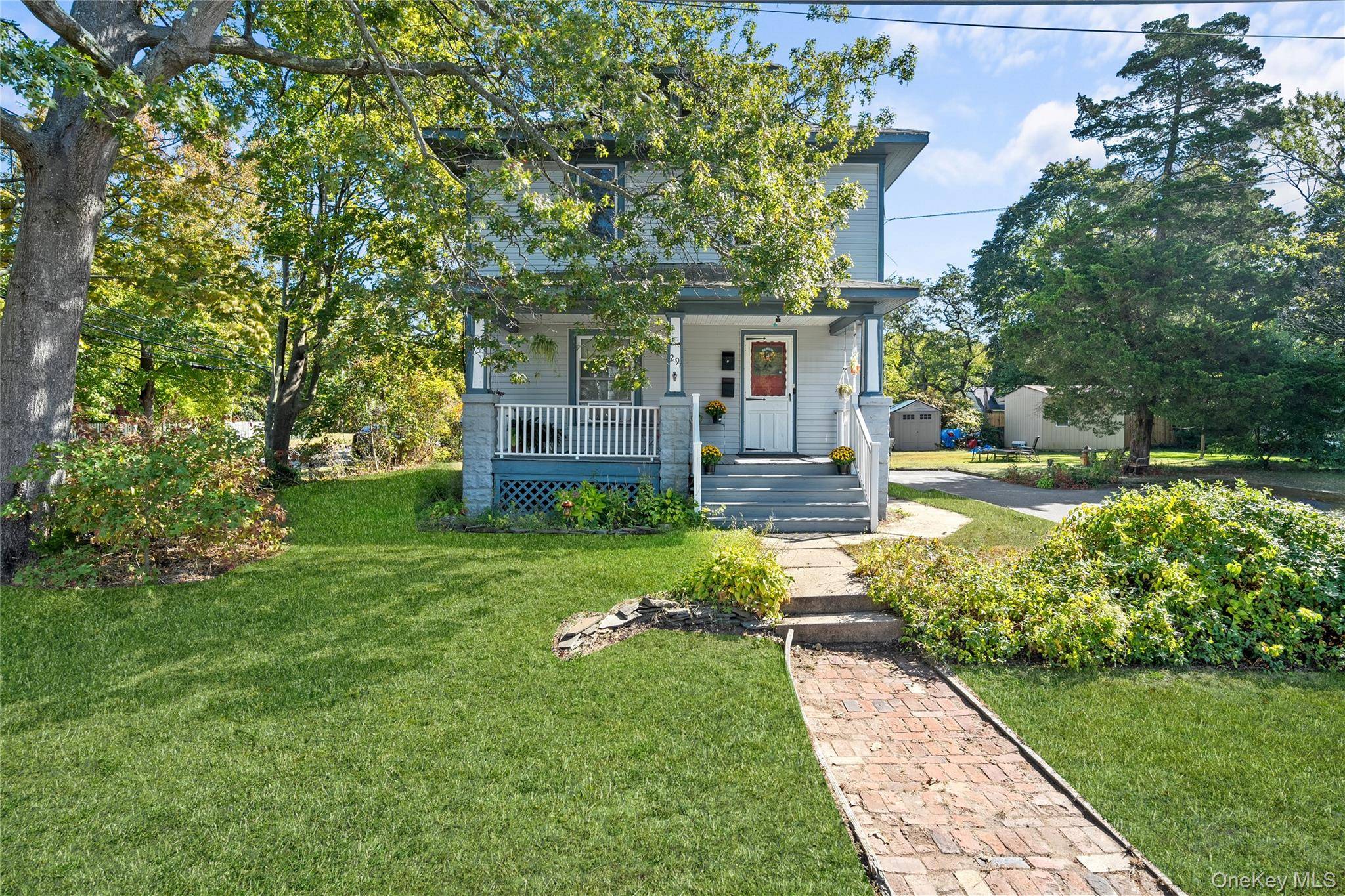 Spacious two family colonial located in the heart of the Village of Amityville.