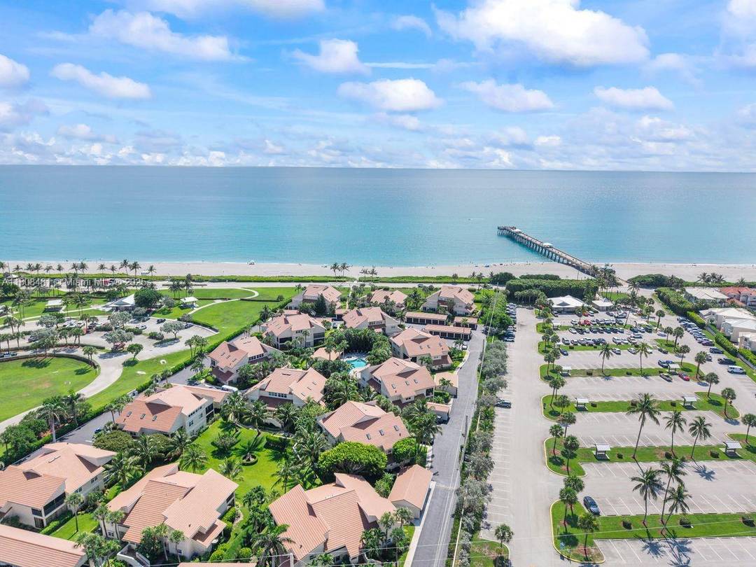 Welcome to an amazing, ground level, fully furnished, turnkey condo that has been thoughtfully updated and renovated, located in a desirable and ocean friendly location in the heart of Jupiter.