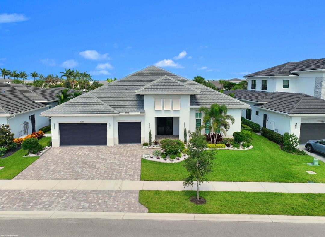 Experience refined Florida living in this exquisite 5 bedroom, 4.
