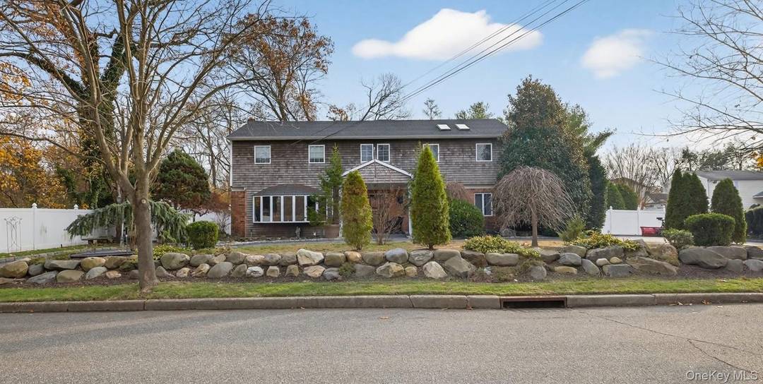 Nestled in the highly desirable Blue Ribbon Commack School District, this spacious just under 4000 sq ft Colonial offers 5 bedrooms and 2.