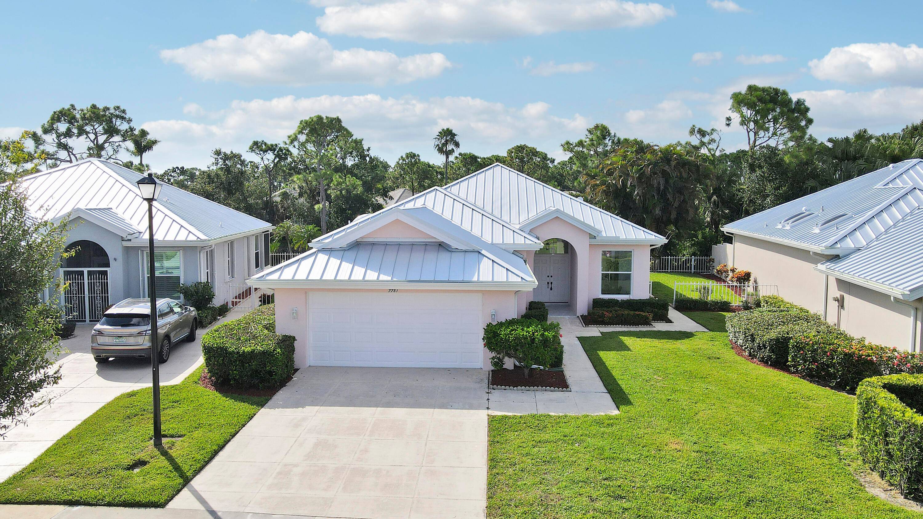 Fully renovated home in The Preserve of Hobe Sound featuring a new metal roof, impact windows, soaring ceilings, and a sleek modern design.