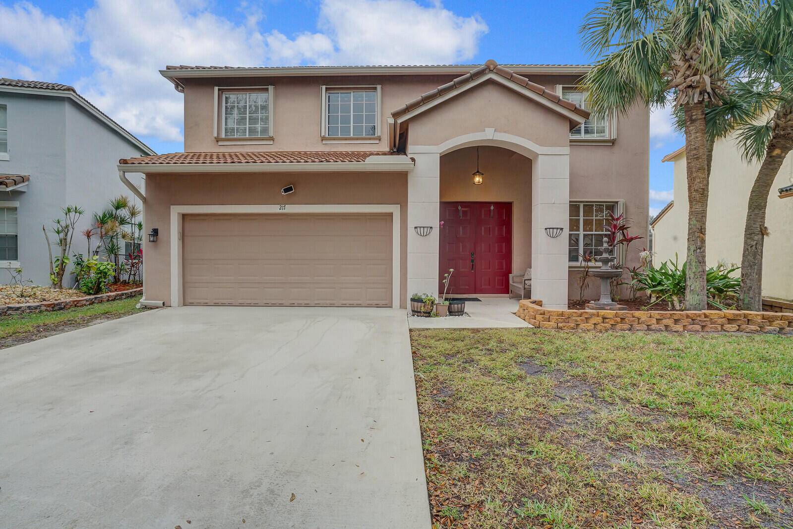 Welcome home to this charming Mediterranean style home nestled in the desirable gated Seminole Estates neighborhood of Royal Palm Beach.