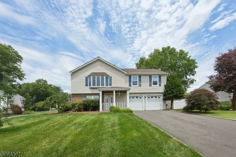 Rarely available and tastefully updated raised ranch in desirable East Hanover !