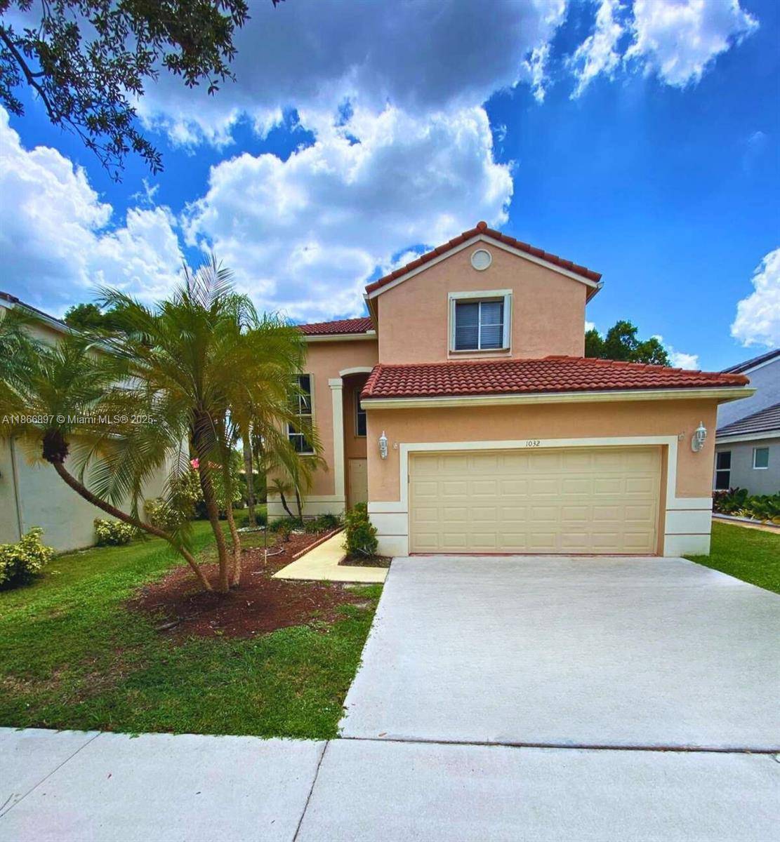 Beautiful two story home in the gated community of The Falls, Weston.