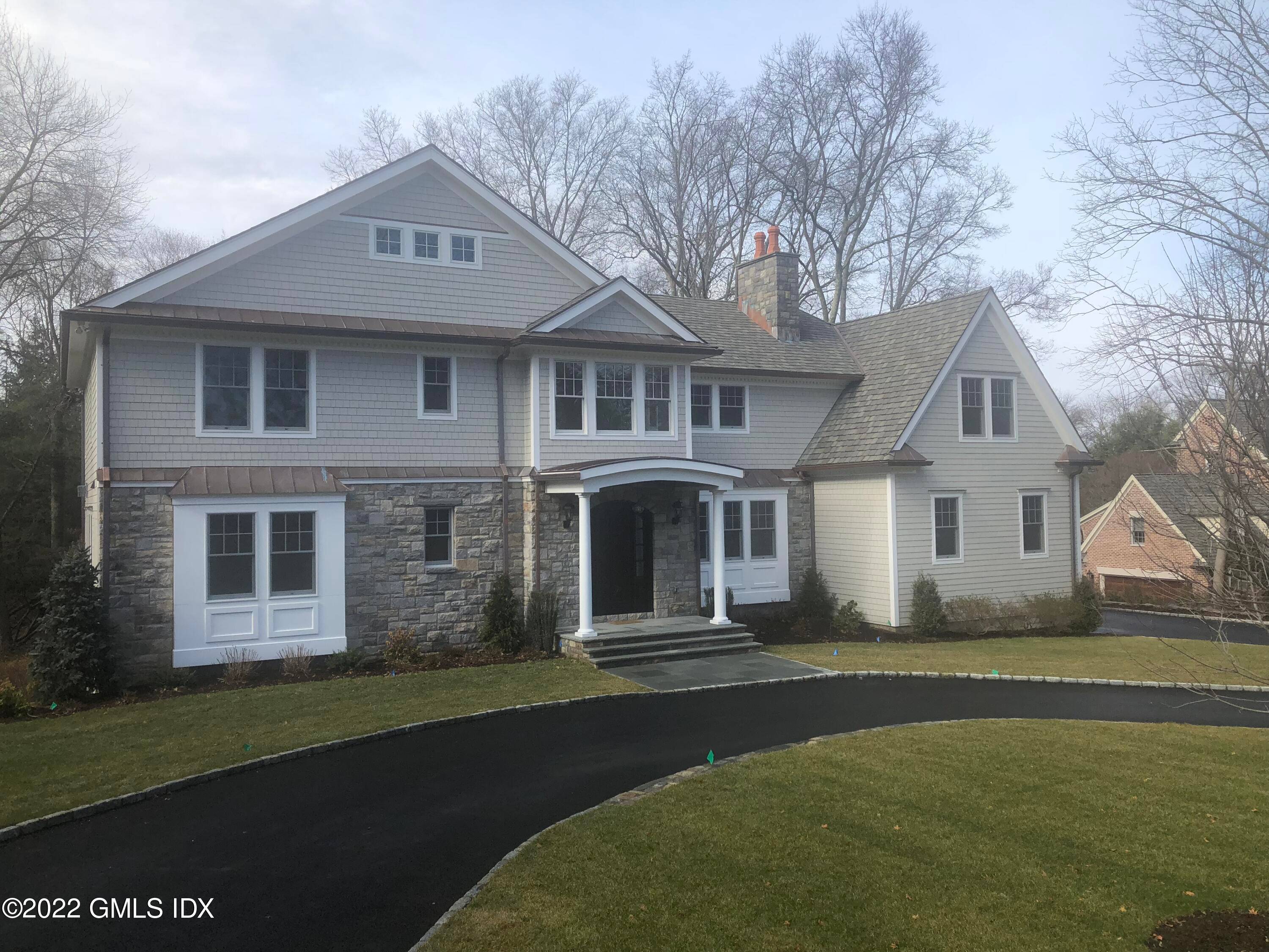 A two story entry with coffered ceilings and wood floors welcomes you into a detailed 5 bedroom, 5.
