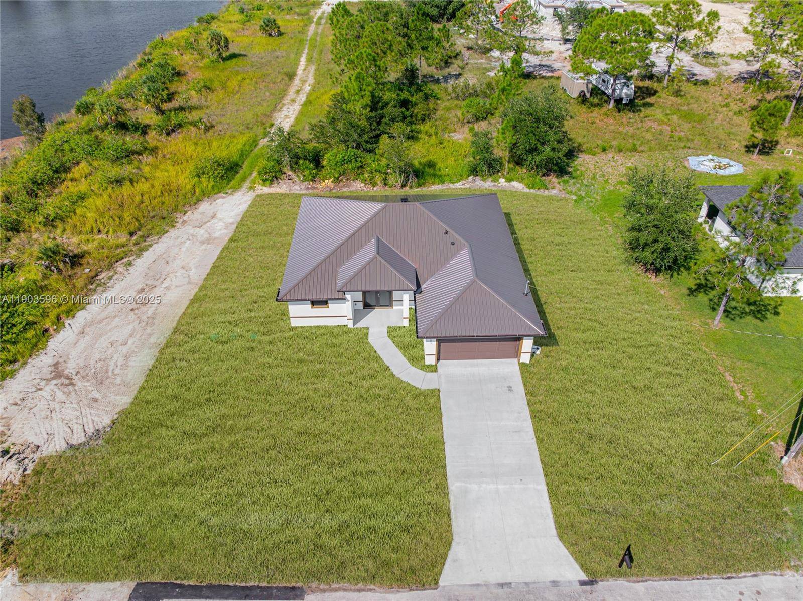 Stunning 3 bedroom, 2 bath lakeview home featuring an open concept layout with white porcelain floors and plenty of natural light.