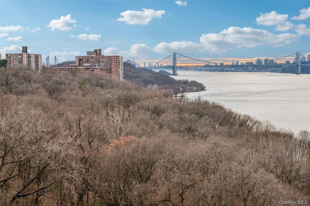 Perched high above the Hudson River, this extraordinary end unit, floor through residence offers a rare fusion of refined luxury and breathtaking natural beauty.