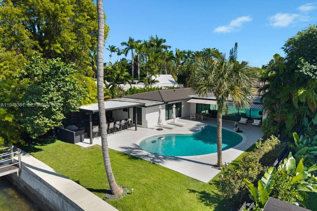 Step Inside With Me ! Recently gut renovated in 2021, this charming beach bungalow within the gated enclave of Biscayne Point offers open bay views along 75 feet of water.