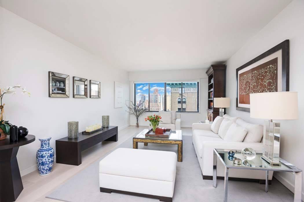 Welcome to this sun filled and luxurious 1 bedroom 2 bath apartment located on the 21st floor of the pristine 900 Park Avenue at the corner of 79th street.