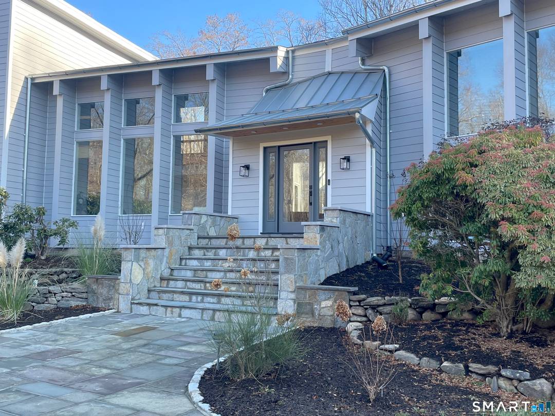 A special contemporary with a pool, on the Westport border, minutes to shops, restaurants and train.