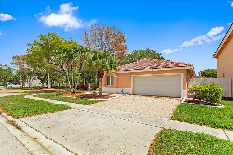 Well maintained 3 2 corner lot home in Miramar featuring a double garage and a spacious backyard ideal for entertaining or future outdoor upgrades.