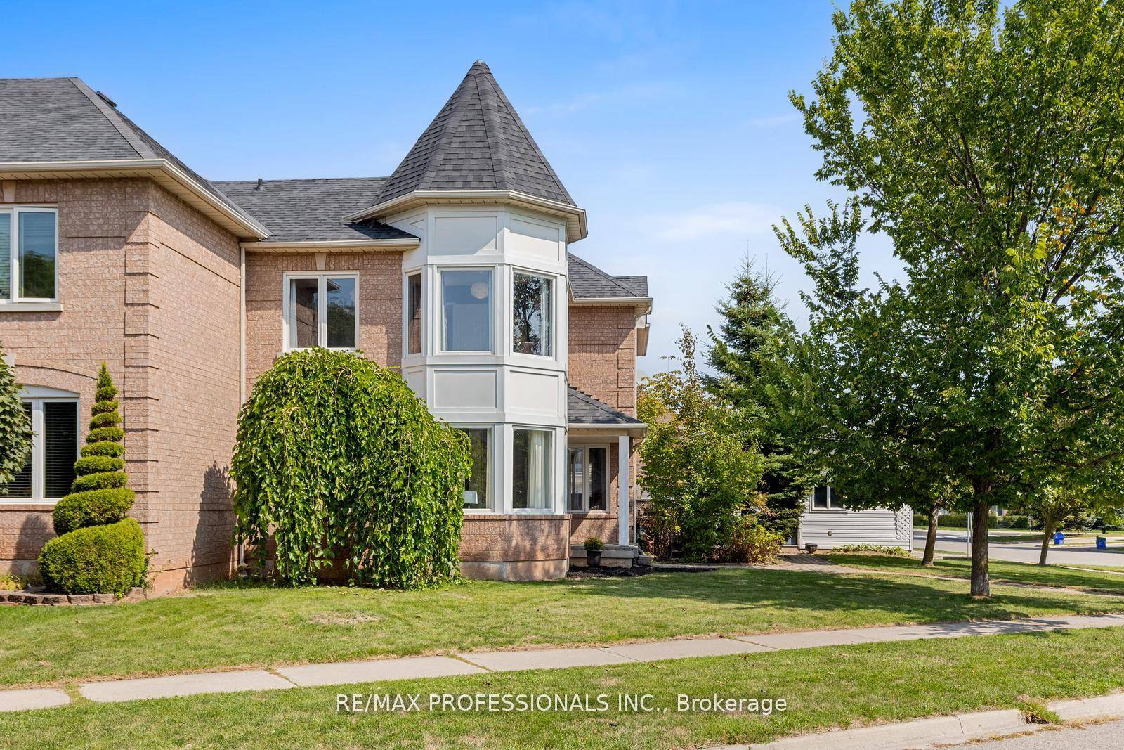 Stylish and spacious end unit freehold townhome on a premium corner lot in Oakvilles sought after West Oak Trails !