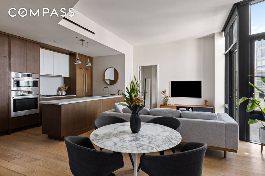 Welcome to Penthouse 5 at 500 Waverly a stunning top floor residence where indoor elegance meets outdoor serenity.