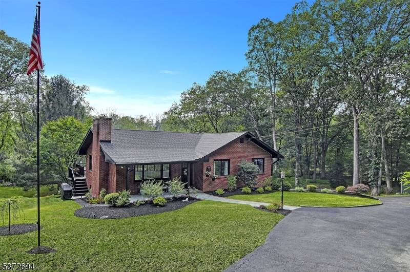 Experience peace and privacy in this Fully Renovated solid brick Ranch situated on 2.