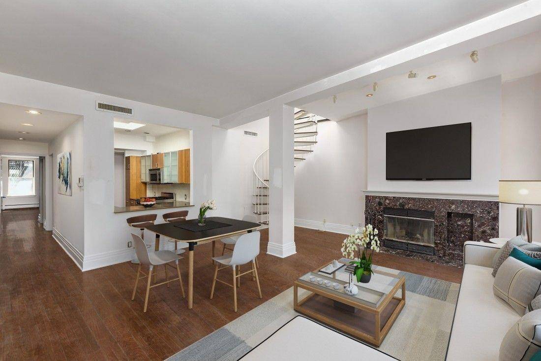 This beautiful brownstone condominium is located on a quiet tree lined street in a prime Manhattan location.