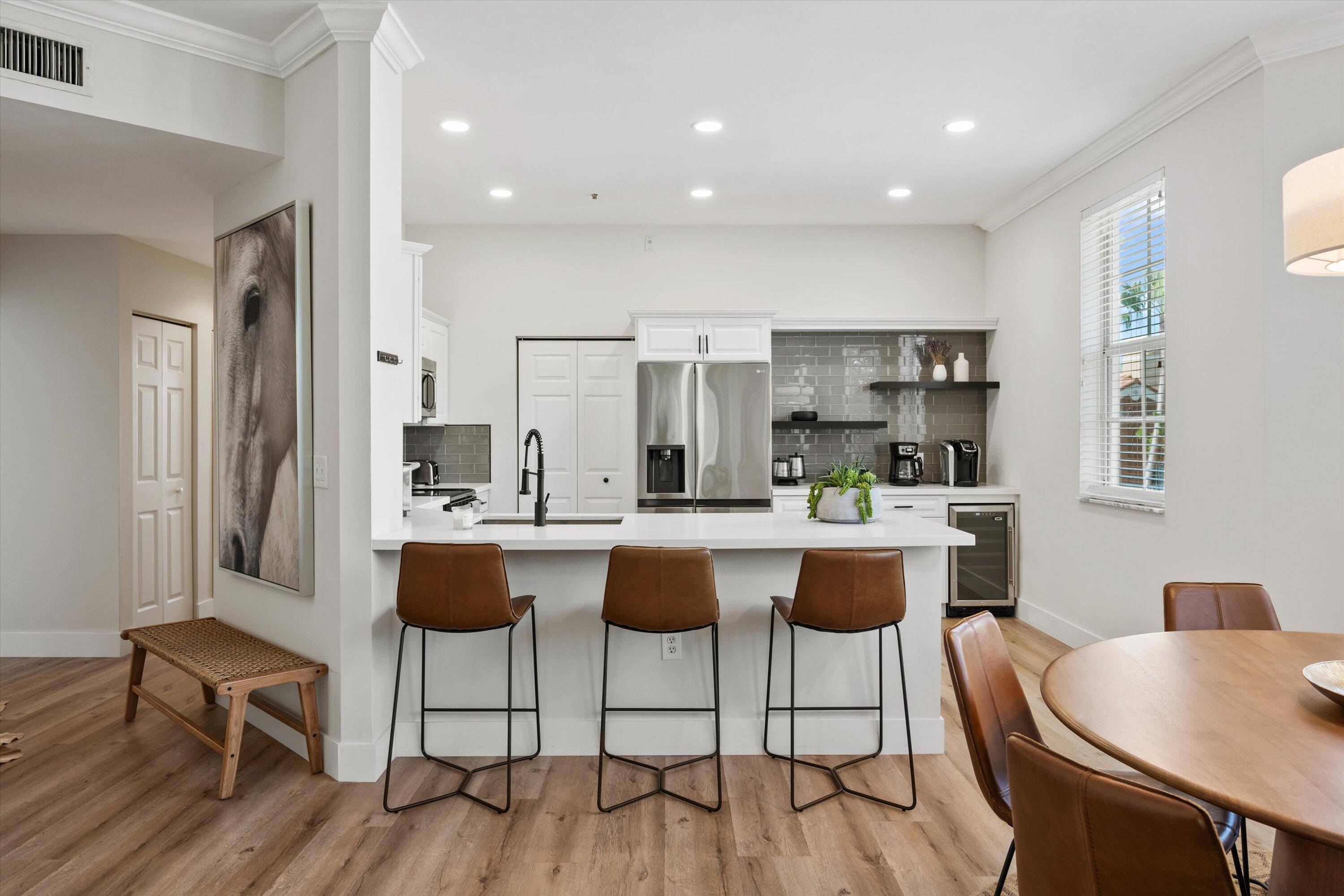 Welcome to this exquisitely renovated 3 bedroom, 2 bathroom corner unit in Saint Andrews at the Polo Club Wellington's premier apartment community.