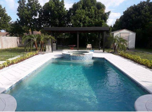 Beautifully updated Spanish style home with a 3 2 main house plus a private 1 1 cottage perfect for guests or extra income.