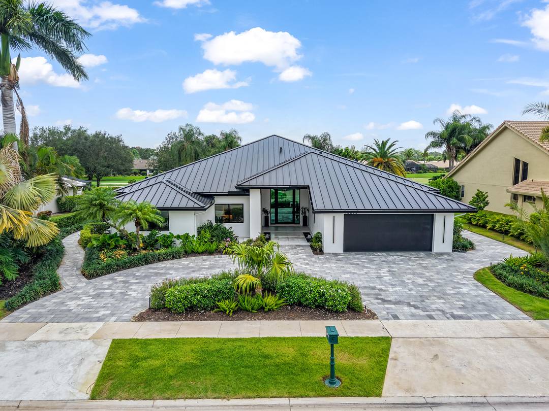 From the moment you arrive, this fully renovated home captivates with a floating water walkway and front glass pivot door.